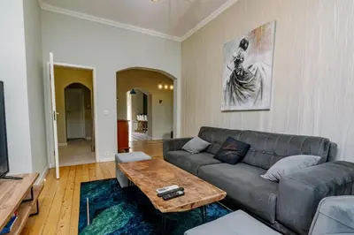 a living room with a couch and a coffee table at 5 Seconds Away from the Main Street, FREE Secured Parking in Sofia