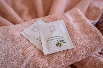 a package of shower gel sitting on top of a towel at Aristocratic Place, TOP location in Sofia
