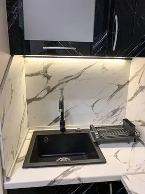 a kitchen sink with a faucet on a counter at Cozy Riverside Pine Studio E5 in Borovets