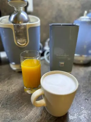 a cup of coffee and a cup of orange juice at Vintage De Lux, Top Location, 2Bdr Grand Monastery, Pamporovo in Pamporovo