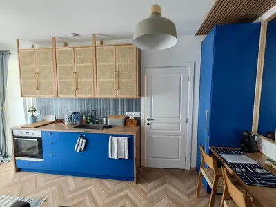 a kitchen with blue cabinets and a blue counter at Royal Blue River Pearl in Sandanski