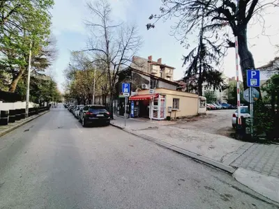 a street with cars parked on the side of the road at Cappuccino Dream in Sofia
