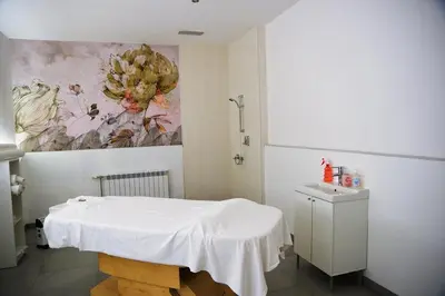 a bathroom with a white table and a painting on the wall at Spacious studio sleeps 4 in Flora main building 706A in Borovets