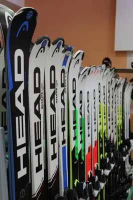 a bunch of skis are lined up in a row at Spacious studio sleeps 4 in Flora main building 706A in Borovets