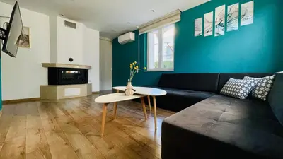 a living room with a couch and a table at Forest Oasis Guest House FREE PARKING in Sapareva Banya
