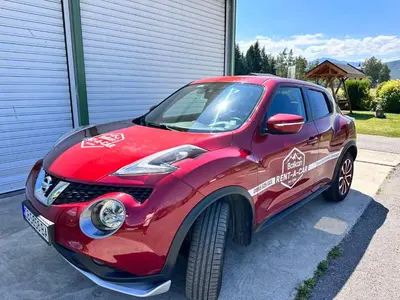 a red car is parked in a driveway at Studio Royal Plaza sleeps 4 Prime location, distance to ski lift - 50M in Borovets