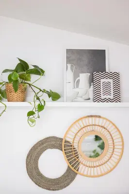 a shelf with a plate and a mirror on it at Alexandra's City Center Apartment III in Sofia