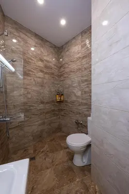 a bathroom with a toilet and a shower and a sink at Julie Suite Top Center in Sofia