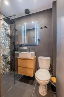 a bathroom with a toilet and a sink and a shower at Calm, Luxury Apartment, Premium Location at NDK! in Sofia