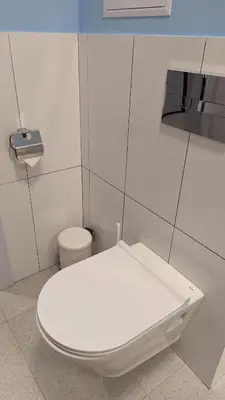 a bathroom with a white toilet and a sink at 65 Duck House in Sofia