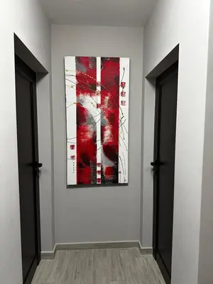 a painting on a wall in a room with two doors at Brown Mur in Sofia