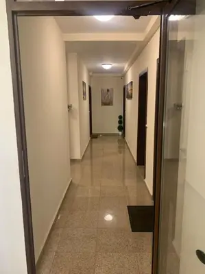 a hallway in a building with a glass door at Brown Mur in Sofia
