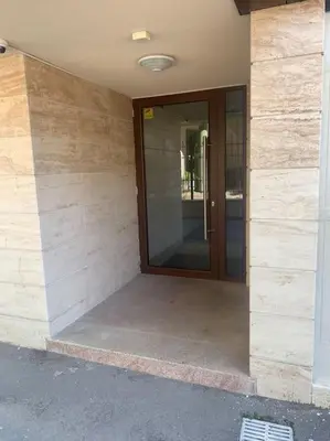 a front door of a building with a glass door at Brown Mur in Sofia
