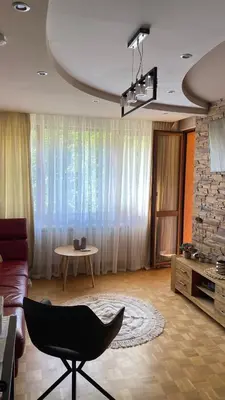 a living room with a couch and a chair at Eda Aparts in Devin