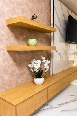 a wooden shelf with a vase of flowers on it at West Haven Apartments - 1BDs in Plovdiv Centre by Flat Mаnager in Plovdiv