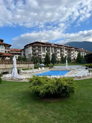 a resort with a swimming pool and a large building at Bansko Royal Towers - Studio 856 in Bansko