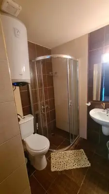 a bathroom with a toilet and a shower and a sink at Bansko Royal Towers - Studio 856 in Bansko