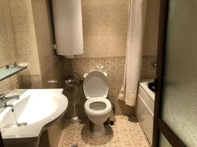 a bathroom with a white toilet and a sink at Simon1 studio, 2 min to gondola in Bansko