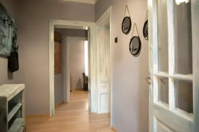 a room with a hallway with a door and a room with a hallway at The Cozy Corner in Sofia