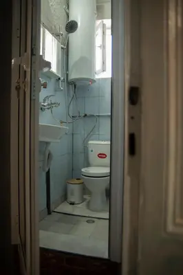 a bathroom with a toilet and a sink at The Cozy Corner in Sofia