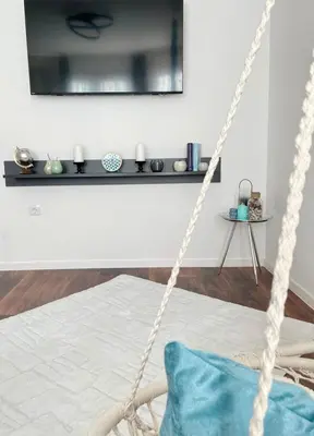 a rope swing in a room with a bed at Si apartments Free Parking in Sofia