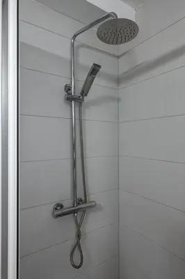 a shower with a shower head in a bathroom at Cozy Studio - Your Home Away From Home by Flat Mаnager in Sofia