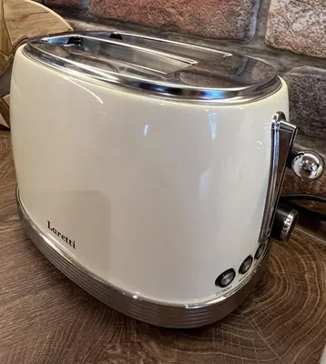a toaster sitting on top of a wooden table at River's house, free parking! in Sofia