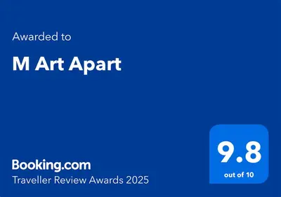 a blue sign with the text upgraded to m art apr at M Art Apart in Sofia