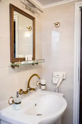 a bathroom with a sink and a mirror at Къща ЕТНО in Koprivshtitsa