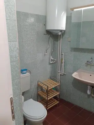a bathroom with a toilet and a sink at Apartment Lozenetz in Sofia