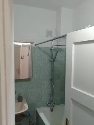 a bathroom with a shower with a toilet and a sink at Apartment Lozenetz in Sofia