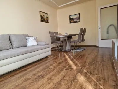 a living room with a couch and a table at Apartment's Ortakchiev 2 in Sofia