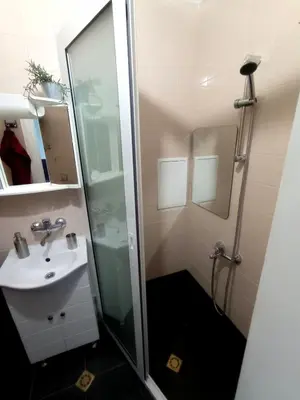 a bathroom with a shower and a sink at Lovely 1 bdr apartment in Sofia city center in Sofia