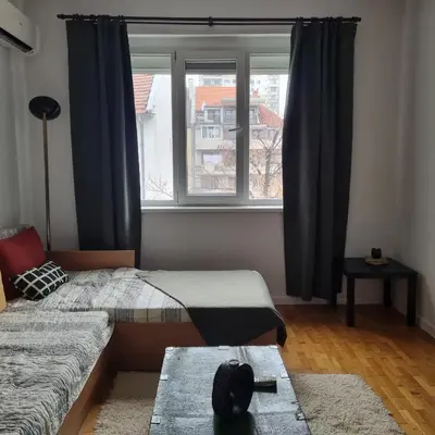 a bedroom with two beds and a window at Lovely 1 bdr apartment in Sofia city center in Sofia