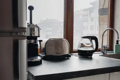 a toaster sitting on a kitchen counter next to a window at Seasons stay Bansko in Bansko