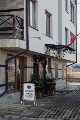 a building with a sign in front of it at Seasons stay Bansko in Bansko