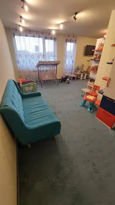 a room with a couch and a table in a room at Belvedere Holiday Club - Mountain View in Bansko
