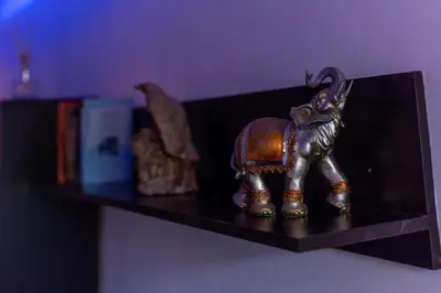 a figurine of an elephant sitting on a shelf at Cozy Apart TOP Center AUBG Free Garage Parking in Blagoevgrad