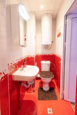 a bathroom with a white toilet and a sink at Cozy Apart TOP Center AUBG Free Garage Parking in Blagoevgrad