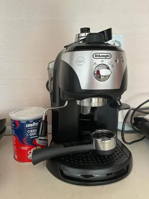 a coffee maker sitting on a counter next to a cup at COZY ski-to-door apartment, Monastery 3 complex in Pamporovo