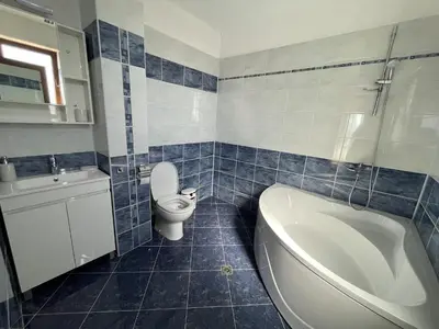 a bathroom with a toilet and a tub and a sink at Panorama view apartment in Sandanski
