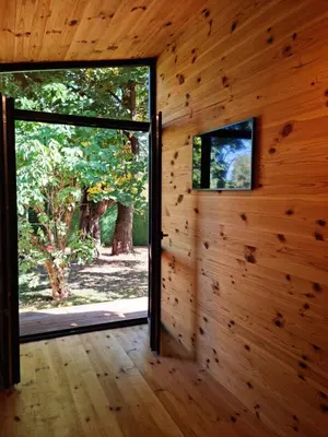 an open door in a log cabin with a window at Sofia Town House, FREE PARKING in Sofia