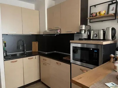 a kitchen with a sink and a microwave at Luxury Studio in Alpinе Lodge FREE SPA in Bansko