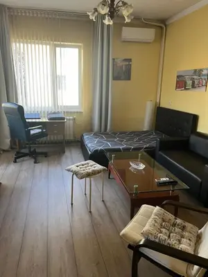 a living room with a couch and a table at The Heart of Old Sofia (Shipka Street 24) in Sofia