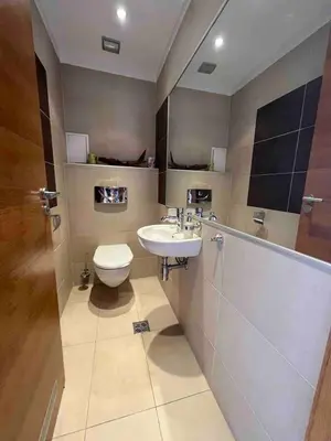 a bathroom with a sink and a toilet at Silver city in Sofia