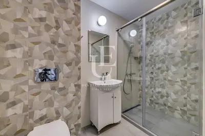 a bathroom with a sink and a shower at Madrid: A modern 2-bedroom apartment with parking in Sofia