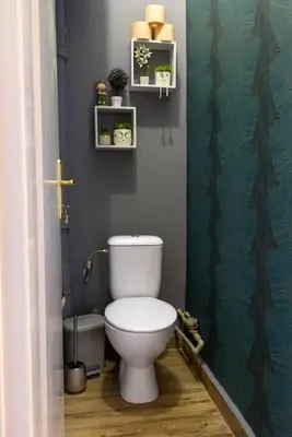 a bathroom with a white toilet in a room at Beauty downtown - TOP CENTER in Sofia