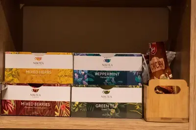 four boxes of food sitting on top of a shelf at Urban Elegance by Eagles' Bridge in Sofia