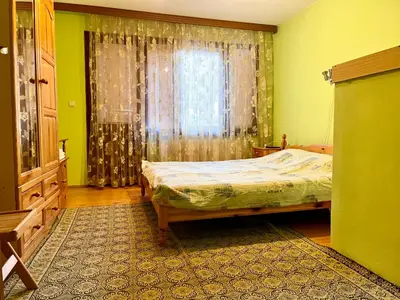 a bedroom with a bed and a window at Vila Omainiche Ribarica in Ribarica