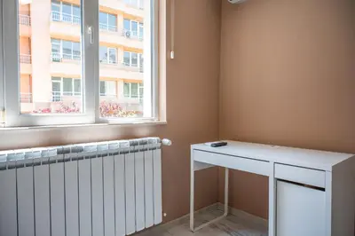a room with a radiator and a window at Elegant spotless apartment in Sofia Center in Sofia